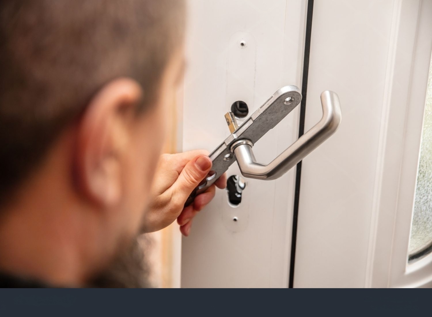 Locksmith rekeying a door lock cylinder so previous keys no longer work